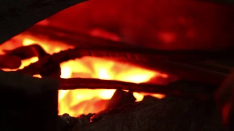 Blacksmith takes metal out of fire Stock-Footage 72219966