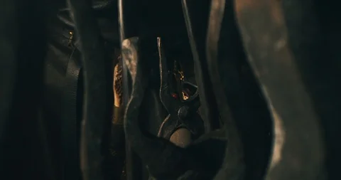 Blacksmith takes pliers from a tool rack (color graded) Stock Footage 126968821