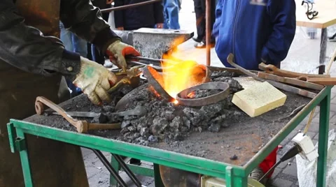 Blacksmith Takes Two Rings Stock Footage 8659553