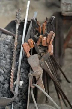 Blacksmith tools next to forge Stock Photos