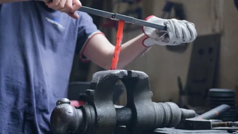 Blacksmith Twisting Hot Metal in Bench Vise – Artisan Technique in Workshop Stock Footage 313861186