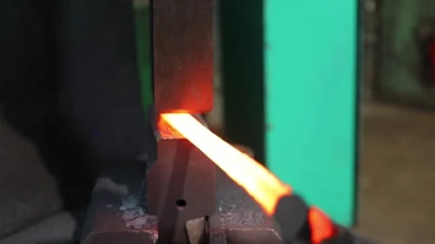 Blacksmith uses his tools Stock Footage 171632973