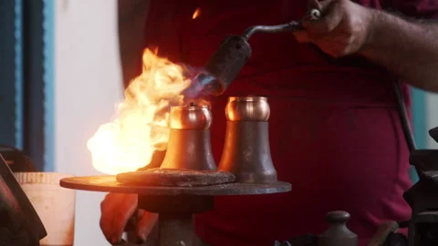 A Blacksmith using the Burner Stock Footage 270210181