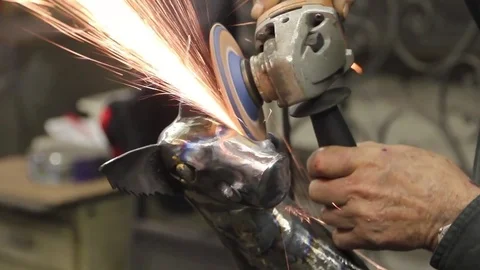 Blacksmith using a Grinder. Lots Of Sparks. Stock Footage 73831478