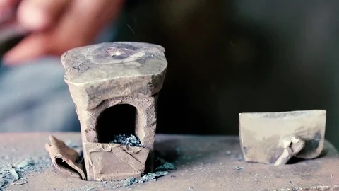 Blacksmith work. Blacksmith beats a piece of white hot metal with a hammer on an Stock Footage 76373678