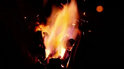 Blacksmith work. Blacksmith beats a piece of white hot metal with a hammer on an Stock Footage 76373790