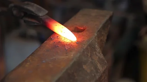 Blacksmith at Work, Close-up of Man Hitting a Hot Red Metal with a Hammer 스톡 동영상 301787541