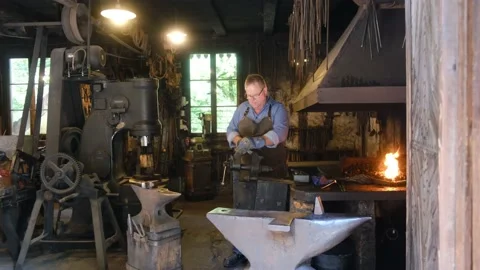 Blacksmith at work Stock Footage 199107111