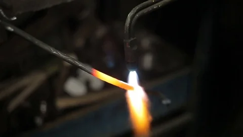 Blacksmith at work in his workshop Stockbeeldmateriaal 80550097
