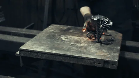 Blacksmith at work in his workshop Stockbeeldmateriaal 88669317
