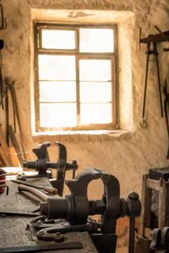Blacksmith workbench with a vise grip Stock Photos