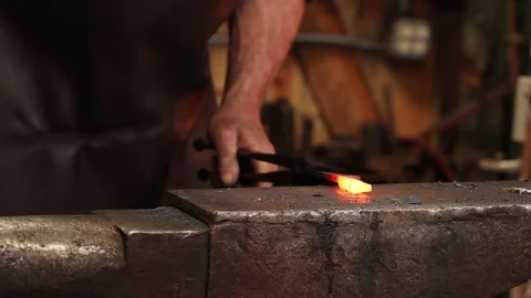 Blacksmith working at the anvil Stock Footage 143168531