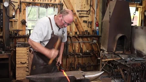 Blacksmith working anvil hot iron Stock Footage 158583035