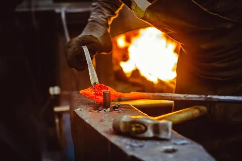 Blacksmith working on an anvil Stock Photos