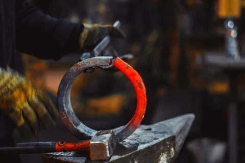 Blacksmith working on an anvil Stock Photos