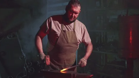 A blacksmith is working in a blacksmith shop Stock Footage 108033008