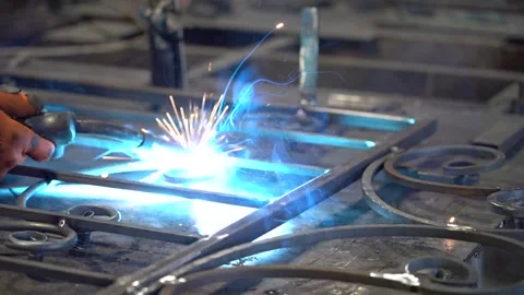The blacksmith is working. The blacksmith welds the product Stock Footage 152135140