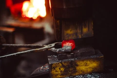 Blacksmith working in the forge Stock Photos
