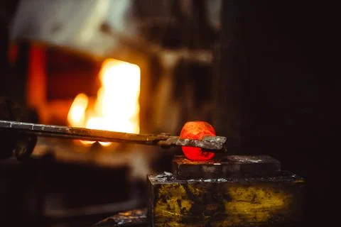 Blacksmith working in the forge Stock Photos