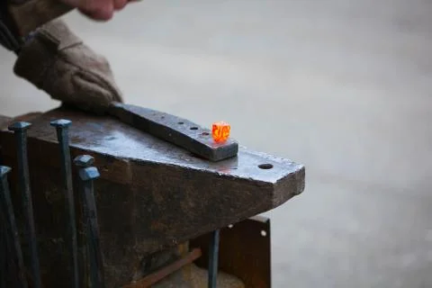 Blacksmith working with a hammer Stock Photos