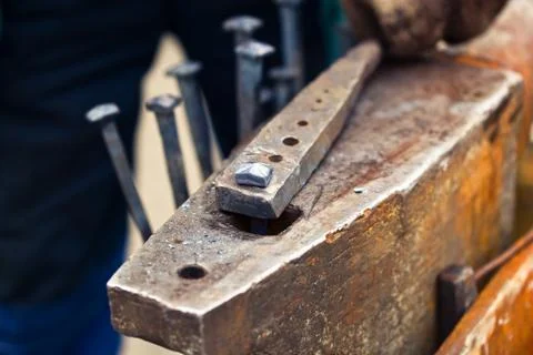 Blacksmith working with a hammer. Stock Photos