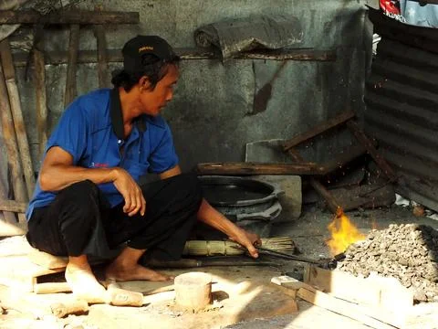 Blacksmith working at his workshop Stock Photos