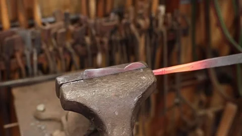 Blacksmith working hot iron in vise Stock Footage 160301983