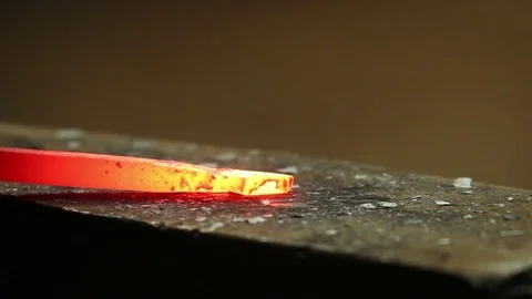Blacksmith working with hot pice of iron Stock Footage 72219599
