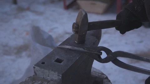 Blacksmith working on metal on anvil at forge high speed detail shot Stock Footage 87868378