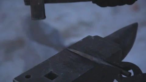 Blacksmith working on metal on anvil at forge high speed detail shot Stock Footage 87868525