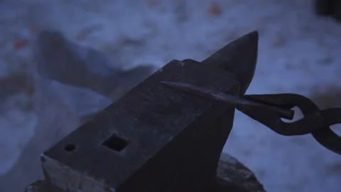 Blacksmith working on metal on anvil at forge high speed detail shot Stock Footage 87868653
