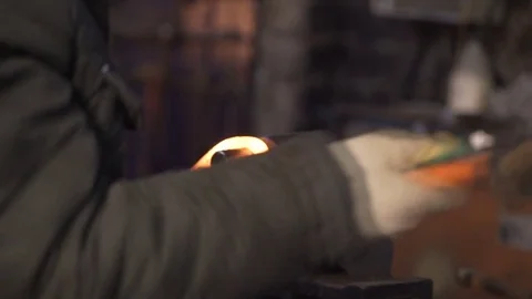 Blacksmith Working with Metal in Coal Fire Stock Footage 73352478
