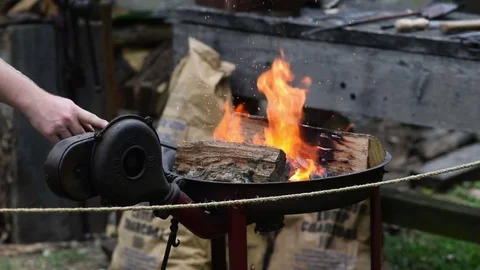 Blacksmith working with metal in fire Stock Footage 78565531