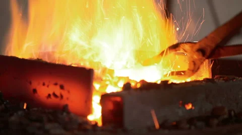 Blacksmith Working With Metal Workpiece In Coal Fire Stock Footage 60376025