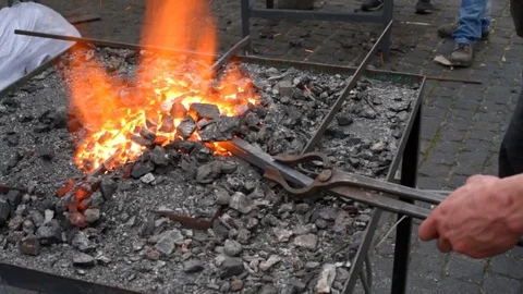 Blacksmith working with molten iron Stock Footage 75741554