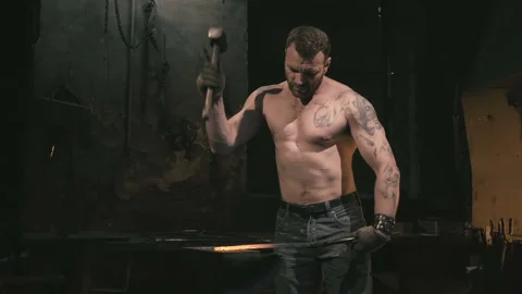 Blacksmith working with a serious face Video stock 109605837