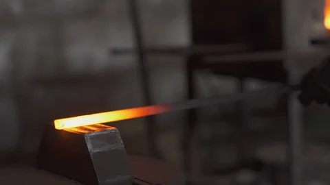 Blacksmith works in the forge, hardens metal, beats a sledgehammer 스톡 동영상 99001802