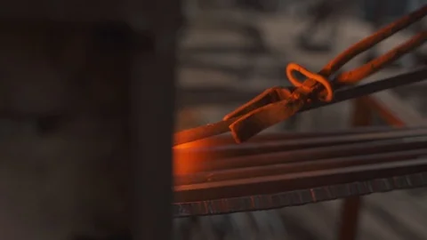 Blacksmith works in the forge, hardens metal, beats a sledgehammer 스톡 동영상 99001815