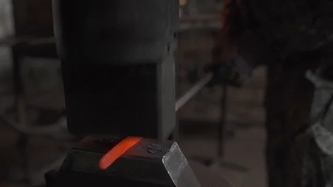Blacksmith works in the forge, hardens metal, beats a sledgehammer 스톡 동영상 99028489