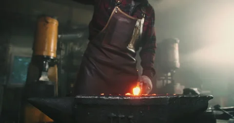 A blacksmith works forging metal close-up Video stock 165212977