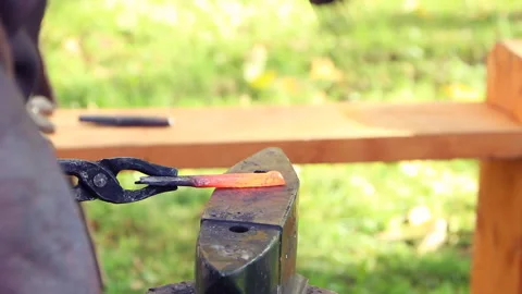 Blacksmith works with hammer and red-hot bar2 Video stock 139962053