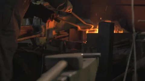 Blacksmith works in his workshop Stock Footage 72694644