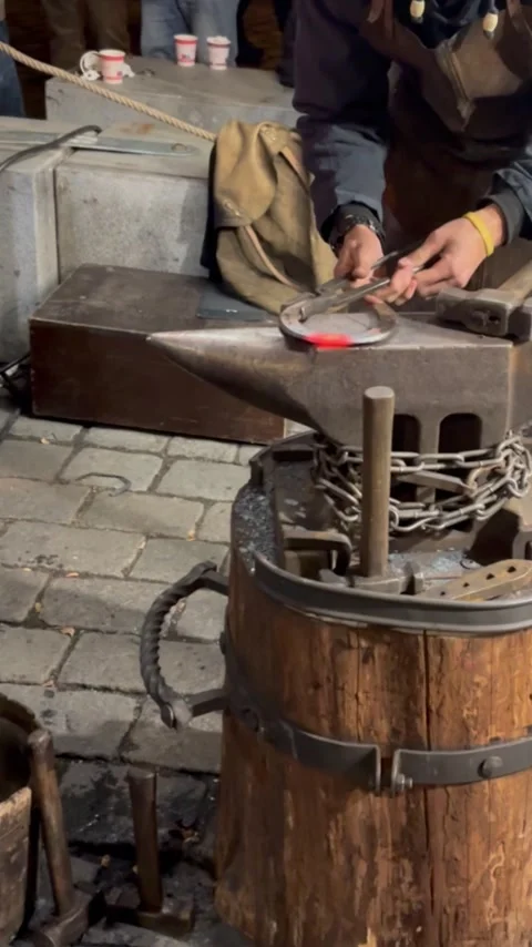 A blacksmith works in medieval clothes Stock Footage 304609761