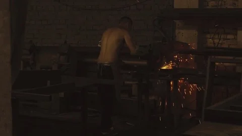 Blacksmith works in smithy Stock Footage 78222636