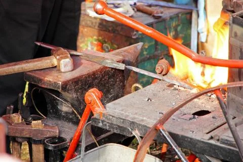 Blacksmith workshop with anvil and fire. Stock Photos