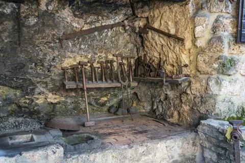 A blacksmith workshop carved into stone Stock Photos