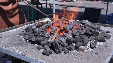 Blacksmithing, burning coal on fire box, master class Stock Footage 335271290
