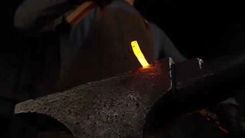 Blacksmithing Hot Metal with Slow Motion Sparks in Forge Stock Footage 255408865