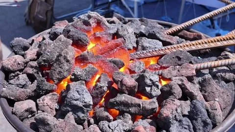Blacksmithing, master class. Heating steel reinforcement Stock Footage 335271443