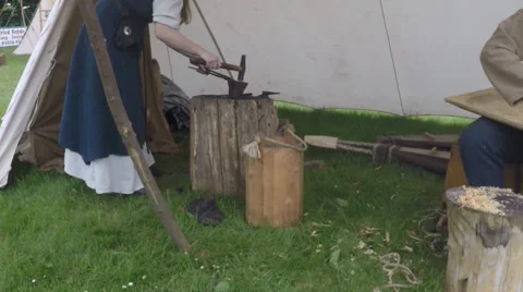 Blacksmithing on a medieval market Stock Footage 64352925